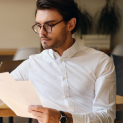 young-serious-businessman-in-eyeglasses-thoughtful-WU7QCKG.png